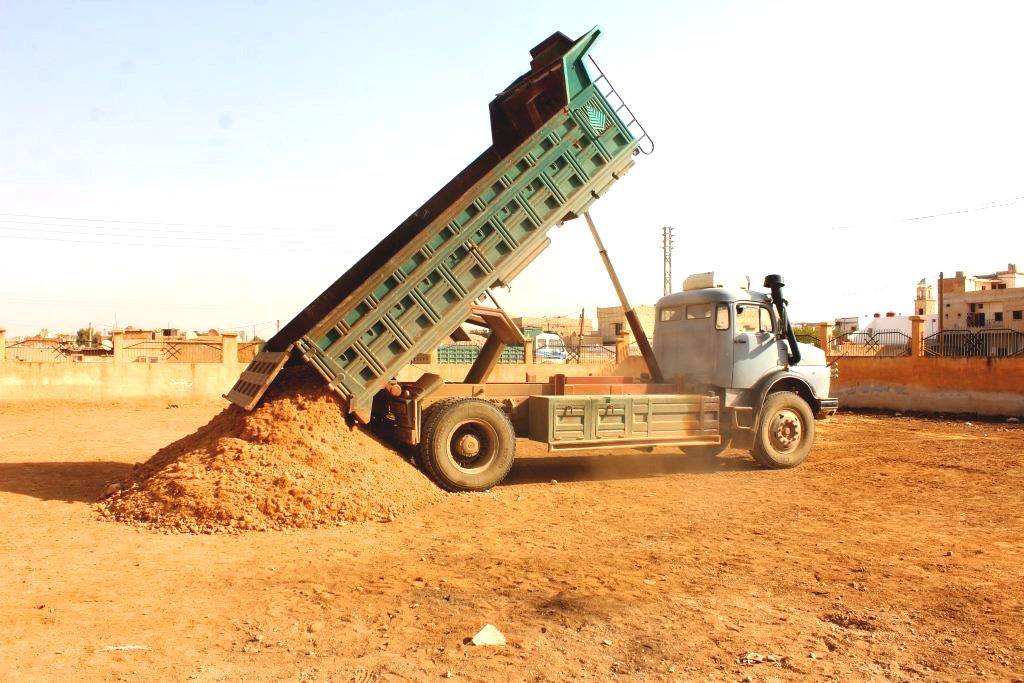 The Technical Department  put crushed stones o the ground of the new garage in  Zargan township .