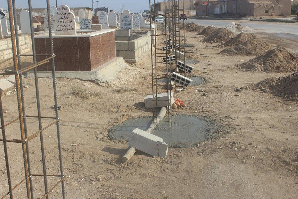 Municipality of people in Amouda surround the cemetery of the city with a wall .
