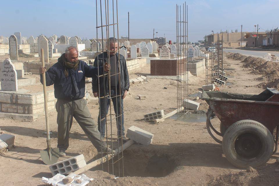 Municipality of people in Amouda surround the cemetery of the city with a wall .
